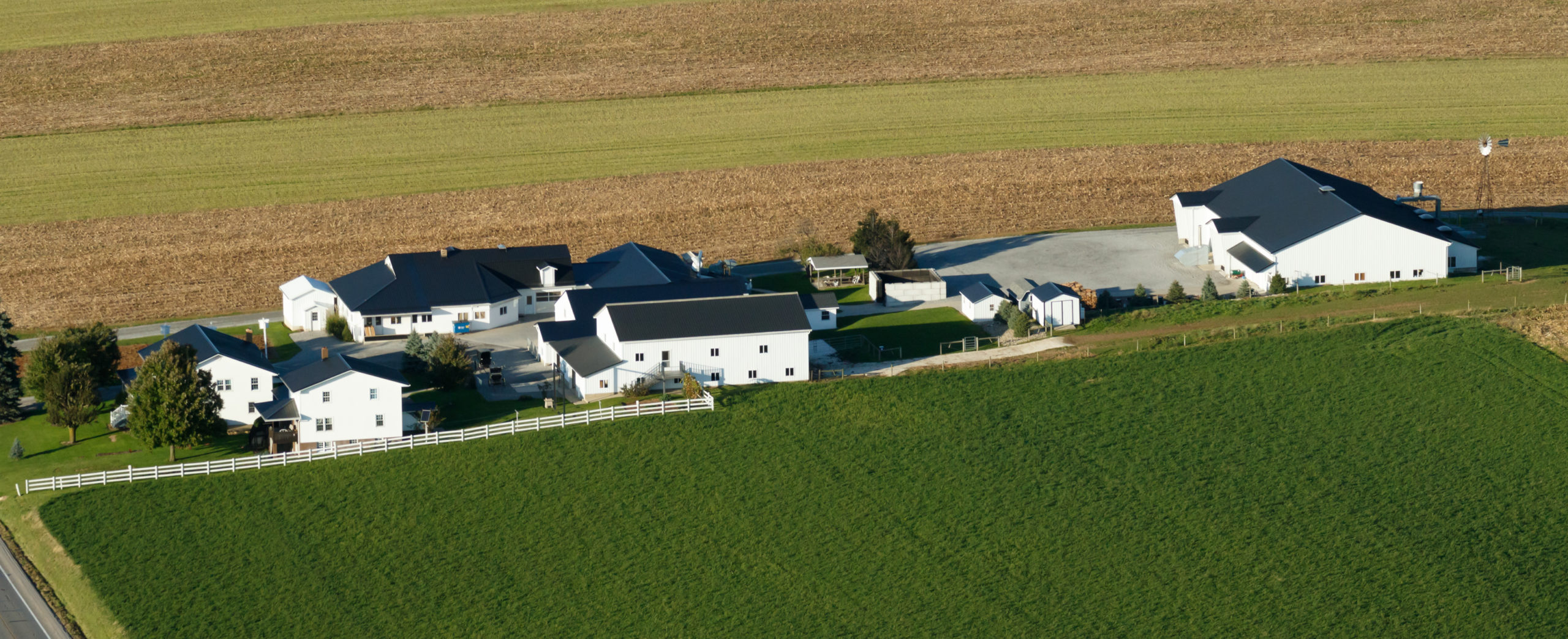 Market to the Amish, Holmes Countty Ohio, White Siding, Black roof, Green fields,