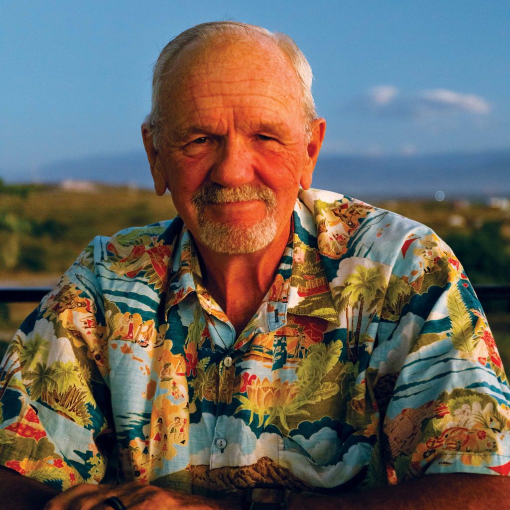 Curt King smiling in his colorful beach themed shirt.