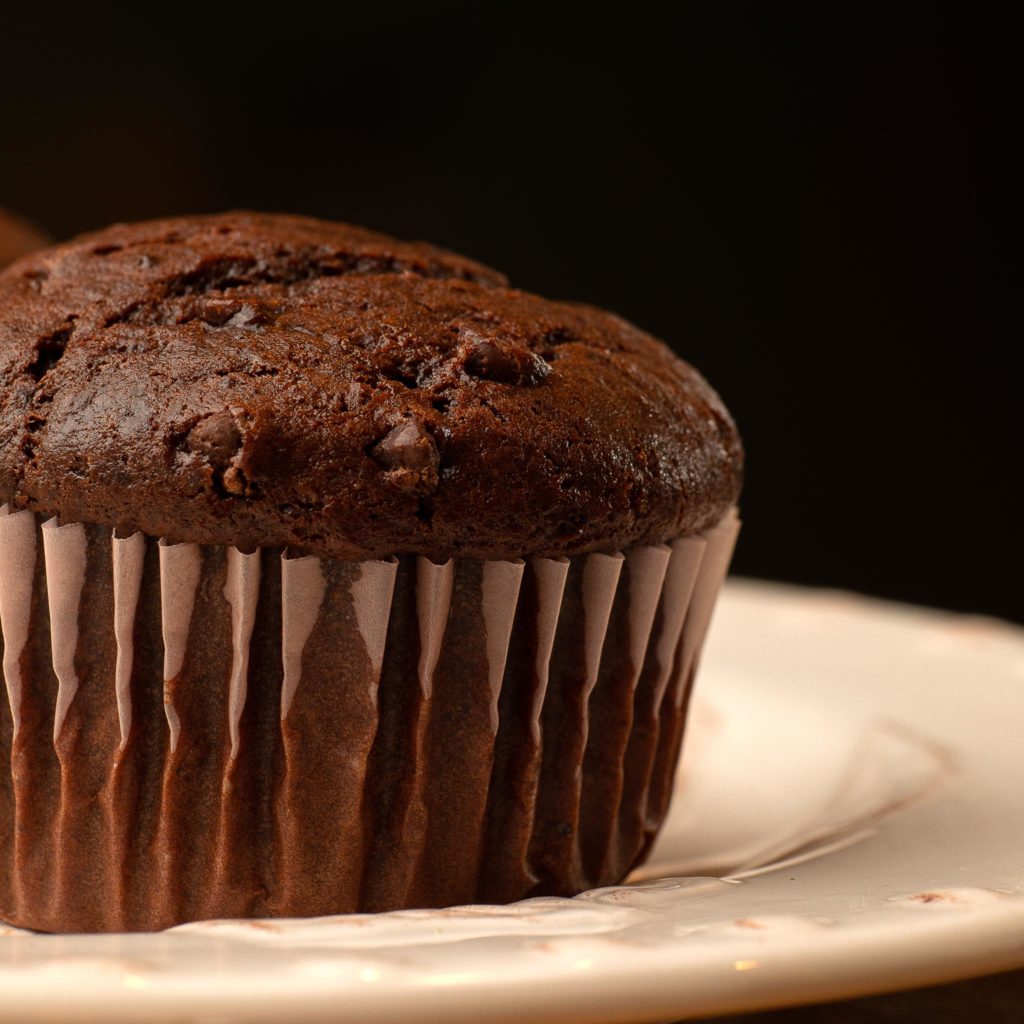 closeup image of chocolate muffin showing textures and details.