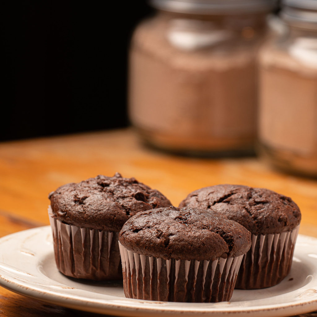 Chocolate Muffins and Mix on wooden table