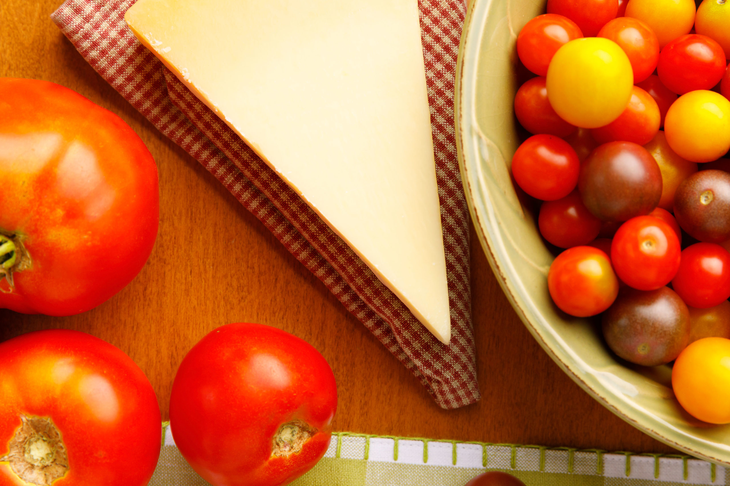 Red Tomatoes, Cheese, Cherry Tomatoes Brown table