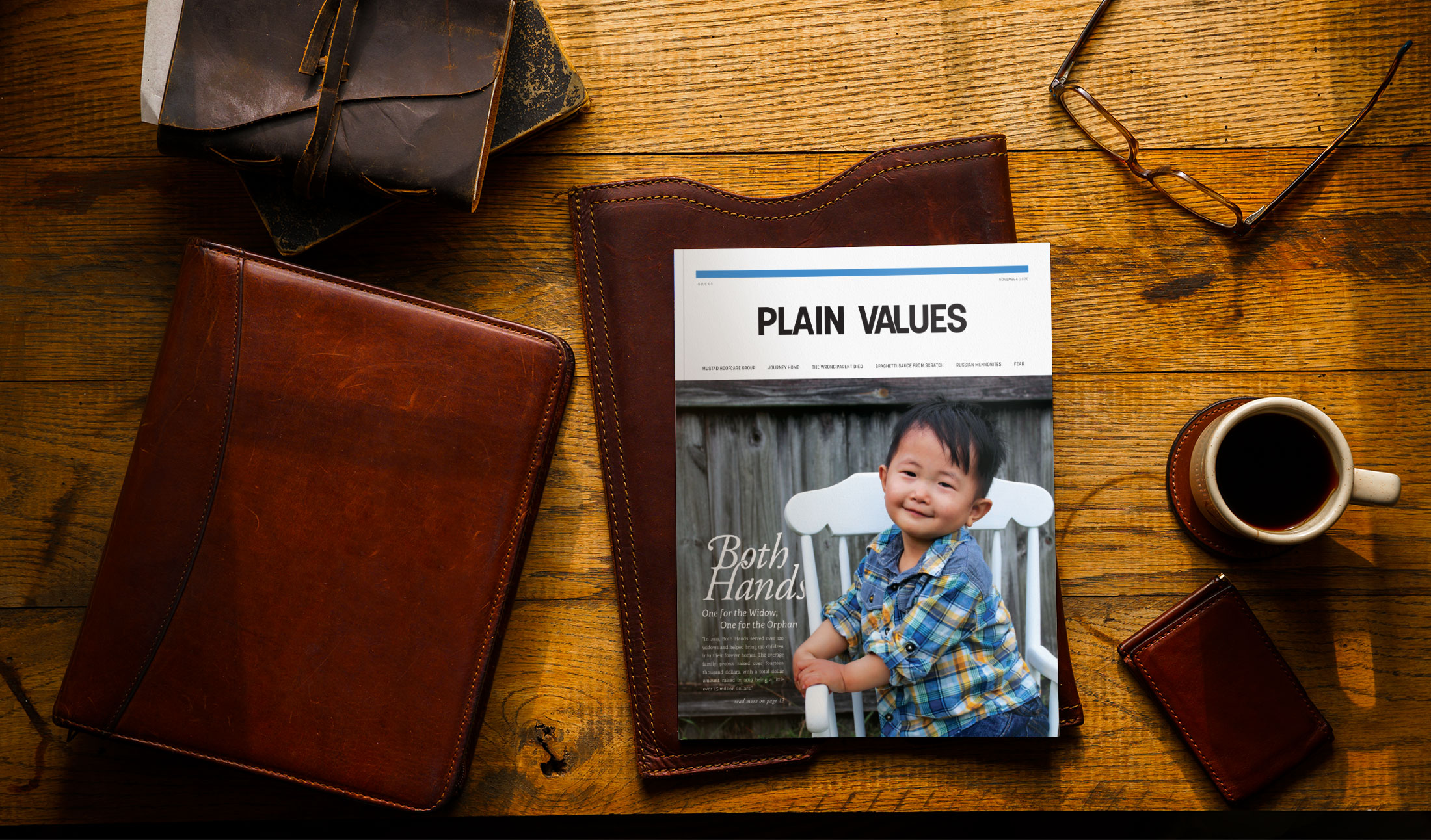PlainValues-CurrentIssue-BothHands-v3 Man Reading Plain Values Magazine