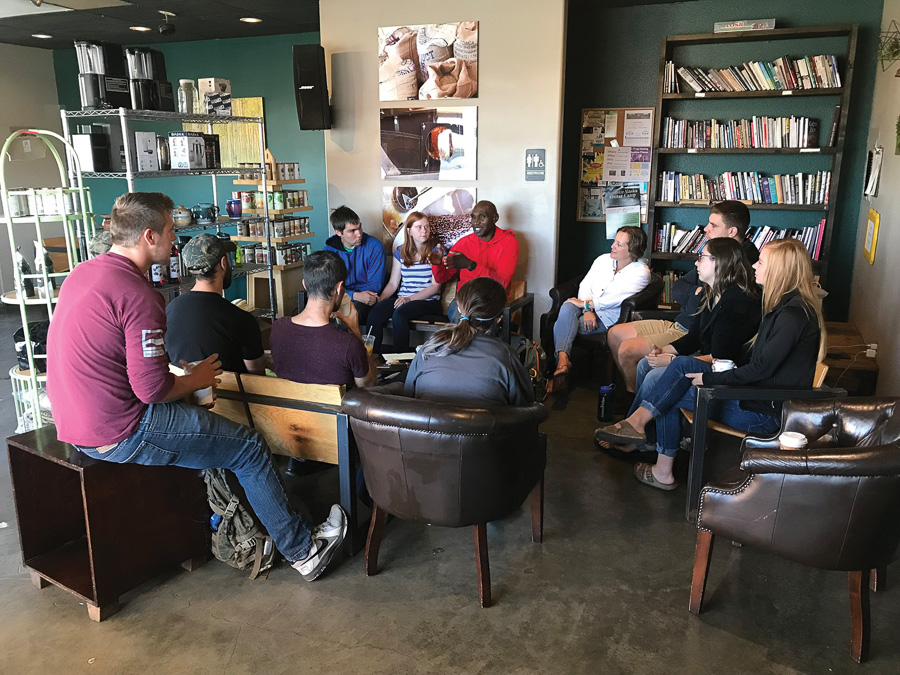 Don Stubbs shares with a group of young peple in a loal coffeeshop.
