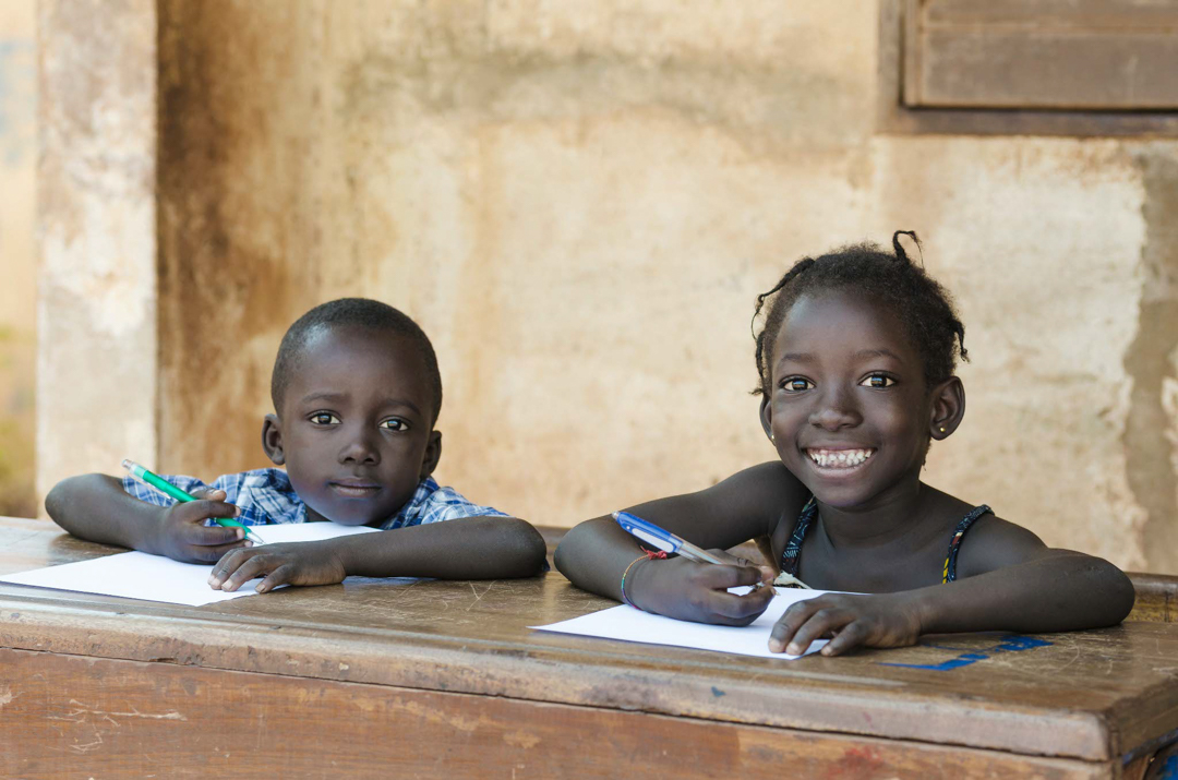 Two African children learning at school