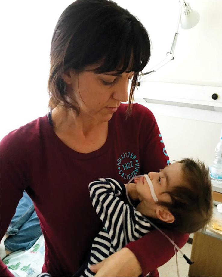 Stacey Gagnon holding her adopted son, Israel
